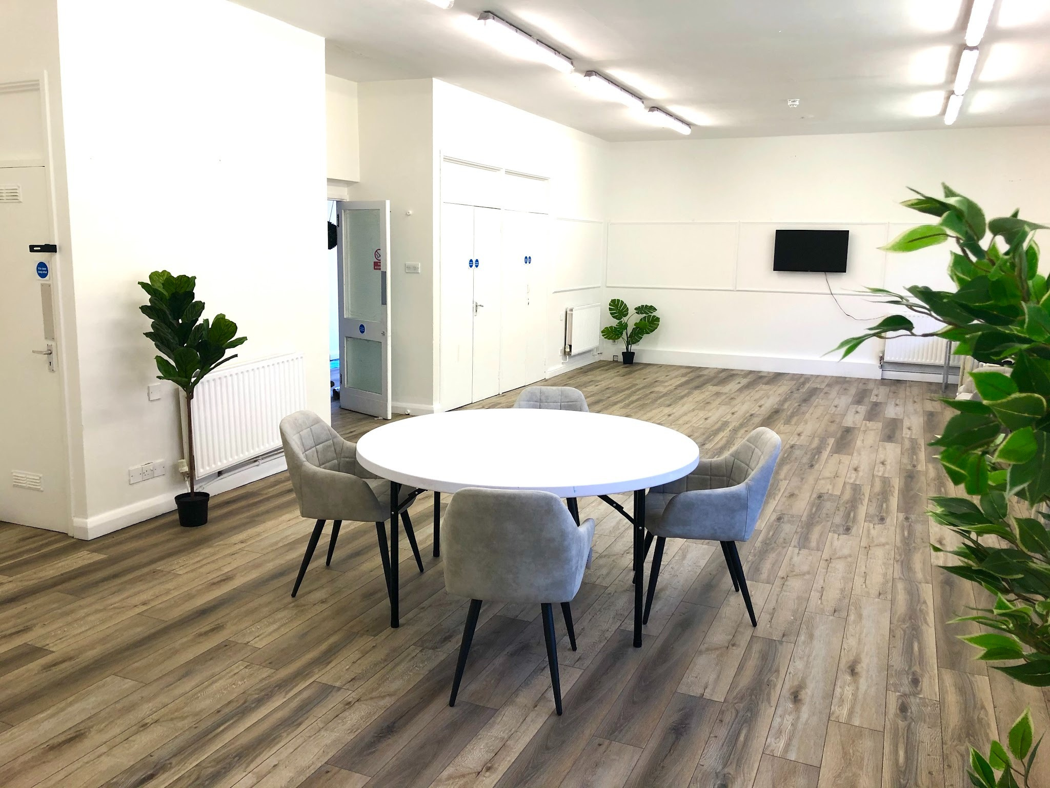 Deronda Hall arranged with a round table and seating