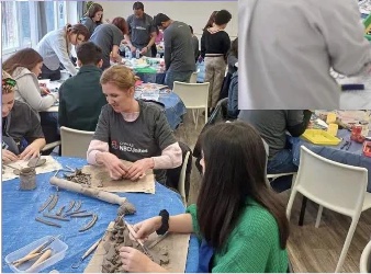 Volunteers creating pieces for the community mosaic.