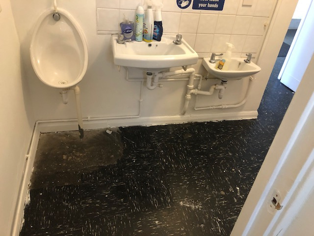 The men’s toilets before improvement.